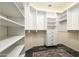 Walk-in closet with custom shelving and drawers maximizing storage at 1890 W Wisteria Dr, Chandler, AZ 85248