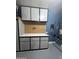 Custom garage storage cabinets provide a large work surface with drawers and pegboard in this home's garage at 1890 W Wisteria Dr, Chandler, AZ 85248