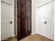 Hallway with two doors, a closet, and tile flooring at 1890 W Wisteria Dr, Chandler, AZ 85248