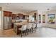 Spacious kitchen with large island, granite counters and dark wood cabinets at 1890 W Wisteria Dr, Chandler, AZ 85248