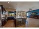 Large kitchen with granite countertops and dark wood cabinets at 1890 W Wisteria Dr, Chandler, AZ 85248