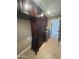 Well-equipped laundry room with dark cabinets and modern appliances at 1890 W Wisteria Dr, Chandler, AZ 85248