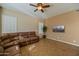 Spacious living room with brown sectional sofa and tile flooring at 1890 W Wisteria Dr, Chandler, AZ 85248