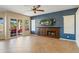 Living room boasts a fireplace and sliding doors to a patio at 1890 W Wisteria Dr, Chandler, AZ 85248