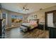 Spacious main bedroom with wood-look floors and ensuite bathroom at 1890 W Wisteria Dr, Chandler, AZ 85248