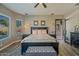Main bedroom features a king-size bed and ensuite bathroom access at 1890 W Wisteria Dr, Chandler, AZ 85248