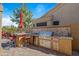 Well-equipped outdoor kitchen with grill and bar seating at 1890 W Wisteria Dr, Chandler, AZ 85248