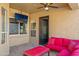 Covered patio with comfortable seating and TV at 1890 W Wisteria Dr, Chandler, AZ 85248