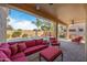Relaxing covered patio with comfortable seating and a view of the pool at 1890 W Wisteria Dr, Chandler, AZ 85248