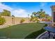 Private putting green with table and chairs at 1890 W Wisteria Dr, Chandler, AZ 85248