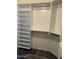 Neat walk-in closet with extensive white shelves and hanging space for efficient storage at 1890 W Wisteria Dr, Chandler, AZ 85248