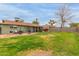 View of home's backyard, including patio and lawn at 2053 E Minton Dr, Tempe, AZ 85282