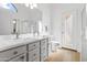 Bathroom boasts dual sinks, a shower, and a door to the backyard at 2329 W Oberlin Way, Phoenix, AZ 85085