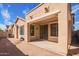 The backyard features a covered patio, brick pavers, and an air conditioning unit at 263 W Rosemary Dr, Chandler, AZ 85248