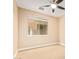 This bedroom has a large window providing natural light and a ceiling fan at 263 W Rosemary Dr, Chandler, AZ 85248
