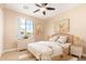 Bright, airy bedroom featuring natural light, ceiling fan, and a peaceful ambiance at 263 W Rosemary Dr, Chandler, AZ 85248