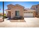 Charming single-Gathering home with a well-maintained lawn, a two-car garage, and desert landscaping at 263 W Rosemary Dr, Chandler, AZ 85248
