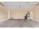 The spacious garage features a water heater, two garage doors and a white door at 263 W Rosemary Dr, Chandler, AZ 85248