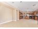 Expansive kitchen with wood cabinetry, granite countertops, tile flooring and space for dining at 263 W Rosemary Dr, Chandler, AZ 85248