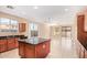 Well-equipped kitchen featuring a center island, modern appliances, and ample counter space with tile flooring at 263 W Rosemary Dr, Chandler, AZ 85248