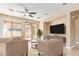 Inviting living room featuring neutral tones, comfortable seating, and access to outdoor patio at 263 W Rosemary Dr, Chandler, AZ 85248
