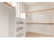 Well-organized walk-in closet with built-in shelving and hanging rods, maximizing storage at 263 W Rosemary Dr, Chandler, AZ 85248