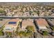Aerial perspective showcasing a home with solar panels, a spacious backyard, and neatly trimmed landscaping at 26335 W Burnett Rd, Buckeye, AZ 85396