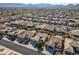 Aerial view of homes in a residential neighborhood with mountain backdrop at 26335 W Burnett Rd, Buckeye, AZ 85396