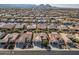 Aerial view of a large community with many houses and mountain views at 26335 W Burnett Rd, Buckeye, AZ 85396