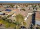Aerial view of a house with solar panels and a landscaped backyard in a residential area at 26335 W Burnett Rd, Buckeye, AZ 85396