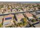 Aerial view showcasing a home's backyard, featuring solar panels and lush landscaping at 26335 W Burnett Rd, Buckeye, AZ 85396