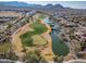 Aerial view showing golf course, lake, and surrounding area at 26335 W Burnett Rd, Buckeye, AZ 85396