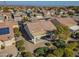 Aerial view of a home's backyard, highlighting a covered patio and well-maintained landscaping at 26335 W Burnett Rd, Buckeye, AZ 85396