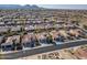 Wide aerial view of a residential neighborhood, showcasing numerous homes and surrounding landscape at 26335 W Burnett Rd, Buckeye, AZ 85396