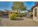 Landscaped backyard with gravel and desert plants at 26335 W Burnett Rd, Buckeye, AZ 85396