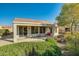 Covered patio with seating area and desert landscaping at 26335 W Burnett Rd, Buckeye, AZ 85396