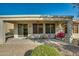 Covered patio with seating area and desert landscaping at 26335 W Burnett Rd, Buckeye, AZ 85396
