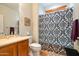 Clean bathroom with shower/tub combo and patterned curtain at 26335 W Burnett Rd, Buckeye, AZ 85396