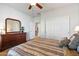 Bedroom with dresser, closet, and ceiling fan at 26335 W Burnett Rd, Buckeye, AZ 85396