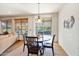 Bright dining area with table and chairs, near sliding glass doors at 26335 W Burnett Rd, Buckeye, AZ 85396