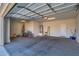 Two-car garage with bikes and storage items at 26335 W Burnett Rd, Buckeye, AZ 85396