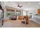 Spacious living room features a large sectional sofa and lots of natural light at 26335 W Burnett Rd, Buckeye, AZ 85396