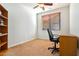 Home office with built-in shelving and desk at 26335 W Burnett Rd, Buckeye, AZ 85396