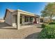 Covered patio with gravel and seating area at 26335 W Burnett Rd, Buckeye, AZ 85396