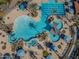 Aerial view of a resort-style pool with a spa, lap lanes, and lounge areas at 26335 W Burnett Rd, Buckeye, AZ 85396
