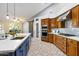 Spacious kitchen with island, stainless steel appliances, and wood cabinets at 2706 E Azalea Ct, Gilbert, AZ 85298