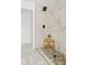 Spa-like shower with marble tile and pebble floor at 2923 E Earll Dr, Phoenix, AZ 85016