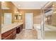 Double vanity bathroom with a large shower and garden tub at 2927 W Plum Hollow Dr, Anthem, AZ 85086