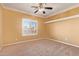 Bright bedroom with ceiling fan, window shutters, and neutral carpeting at 2927 W Plum Hollow Dr, Anthem, AZ 85086