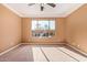 Bright bedroom with large window and plush carpeting at 2927 W Plum Hollow Dr, Anthem, AZ 85086